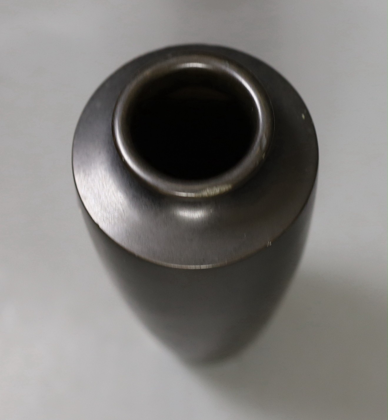 A signed Japanese bronze and mixed metal vase, 21cm